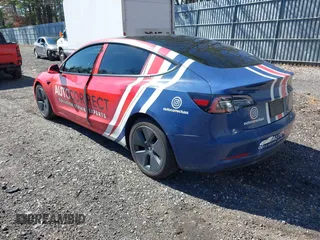 2022 Tesla Model 3 with VIN 5YJ3E1EA5NF168201, listed as a IAAI auction lot 41855273 with 31,393 mi miles and . Bid and sale history available at DreamBid. Image 3.