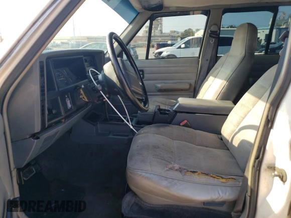 1996 Jeep Cherokee SE with VIN 1J4FT28S3TL197827, listed as a Copart auction lot 75443574 with 116,660 mi miles and Salvage Title. Bid and sale history available at carsss.com. Image 7.