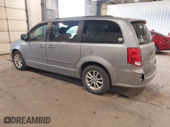 2014 Dodge Grand Caravan SXT with VIN 2C4RDGCG9ER213426, listed as a IAAI auction lot 41044553 with 175,140 mi miles and . Bid and sale history available at DreamBid. Image 3.