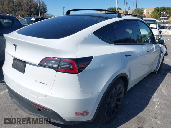 2023 Tesla Model Y Long Range with VIN 7SAYGDEEXPA152986, listed as a IAAI auction lot 41946665 with 13,574 mi miles and . Bid and sale history available at carsss.com. Image 4.