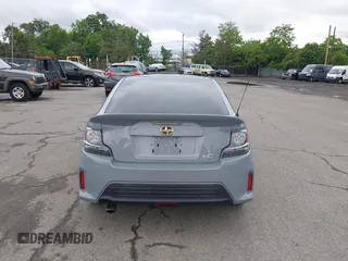 2014 Scion tC z VIN JTKJF5C71E3081033, wystawiony jako IAAI lot #42333111 z przebiegiem 144 124 mil mil oraz . Historia ofert i sprzedaży dostępna na DreamBid. Obrazek 16.