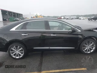 2013 Cadillac XTS Premium z VIN 2G61S5S39D9112491, wystawiony jako IAAI lot #42216373 z przebiegiem 145 338 mil mil oraz . Historia ofert i sprzedaży dostępna na DreamBid. Obrazek 13.