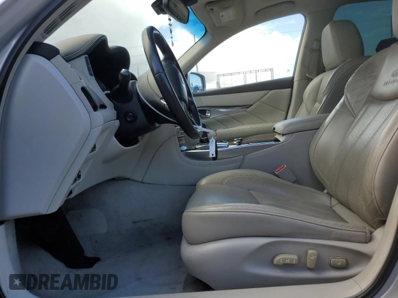 2012 Infiniti M Hybrid with VIN JN1EY1AP3CM910631, listed as a Copart auction lot 49162705 with 128,771 mi miles and Salvage title. Bid and sale history available at DreamBid. Image 7.