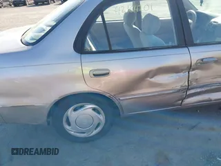 1998 Toyota Corolla VE z VIN 2T1BR18E9WC045442, wystawiony jako IAAI lot #42104201 z przebiegiem 243 256 mil mil oraz . Historia ofert i sprzedaży dostępna na DreamBid. Obrazek 6.