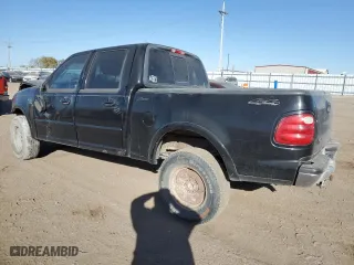 2001 Ford F-150 SuperCrew XLT with VIN 1FTRW08L61KC30586, listed as a Copart auction lot 74439124 with 296,321 mi miles and Salvage Title. Bid and sale history available at carsss.com. Image 2.
