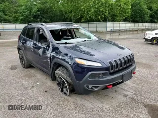2015 Jeep Cherokee Trailhawk with VIN 1C4PJMBB8FW740452, listed as a Copart auction lot 63023715 with 96,236 mi miles and Salvage title. Bid and sale history available at DreamBid. Image 14.