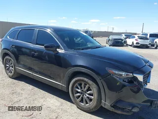 2018 Mazda CX-9 Sport z VIN JM3TCABY8J0223750, wystawiony jako IAAI lot #42155429 z przebiegiem 133 543 mil mil oraz . Historia ofert i sprzedaży dostępna na DreamBid. Obrazek 1.