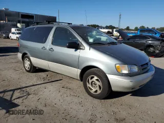 2000 Toyota Sienna LE with VIN 4T3ZF13C2YU281355, listed as a Copart auction lot 76415954 with 133,763 mi miles and Salvage Title. Bid and sale history available at carsss.com. Image 4.