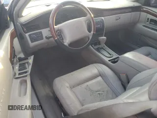 2000 Cadillac Eldorado z VIN 1G6EL12Y0YB704658, wystawiony jako Copart lot #77596814 z przebiegiem Nie podano mil oraz Nie do naprawy • Non repairable. Historia ofert i sprzedaży dostępna na DreamBid. Obrazek 8.