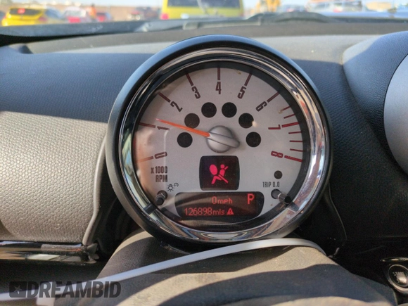 2012 MINI Countryman S with VIN WMWZC5C50CWL63321, listed as a Copart auction lot 52427065 with 126,898 mi miles and Salvage Title. Bid and sale history available at DreamBid. Image 9.