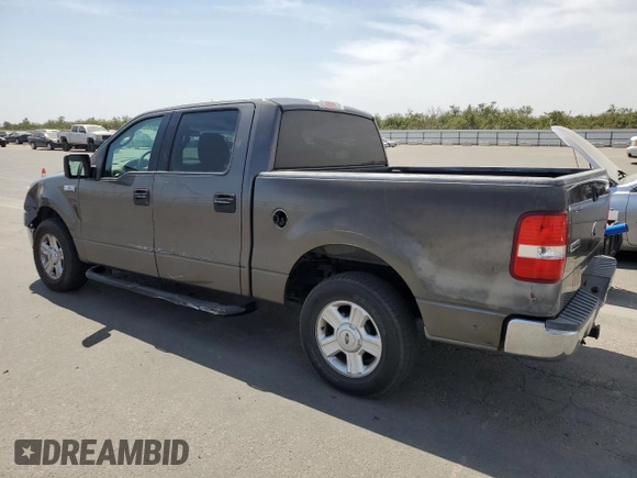 2004 Ford F-150 XLT with VIN 1FTRW12W74KC26169, listed as a Copart auction lot 68393914 with 118,059 mi miles and Salvage Title. Bid and sale history available at DreamBid. Image 2.