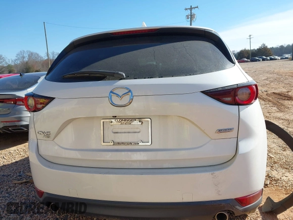 2019 Mazda CX-5 Sport with VIN JM3KFBBM0K0574255, listed as a IAAI auction lot 41661924 with 93,851 mi miles and . Bid and sale history available at DreamBid. Image 16.