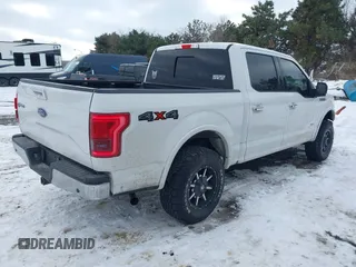 2015 Ford F-150 XLT with VIN 1FTEW1EPXFFA26059, listed as a IAAI auction lot 41348308 with 148,499 mi miles. Bid and sale history available at carsss.com. Image 4.