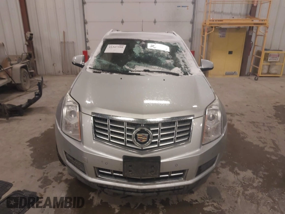 2016 Cadillac SRX Luxury Collection z VIN 3GYFNBE36GS572780, wystawiony jako IAAI lot #41347399 z przebiegiem 166 436 mil mil oraz . Historia ofert i sprzedaży dostępna na DreamBid. Obrazek 12.