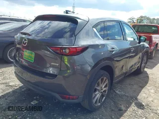 2019 Mazda CX-5 Grand Touring with VIN JM3KFBDM7K0619379, listed as a IAAI auction lot 42007107 with 209,590 mi miles. Bid and sale history available at carsss.com. Image 4.