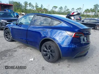 2025 Tesla Model Y Long Range z VIN 7SAYGDED0SF256650, wystawiony jako IAAI lot #41993206 z przebiegiem Nie podano mil oraz . Historia ofert i sprzedaży dostępna na DreamBid. Obrazek 3.