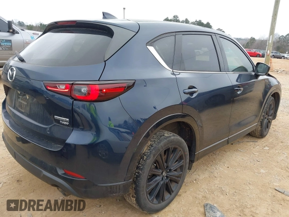 2022 Mazda CX-5 2.5 Turbo with VIN JM3KFBAY5N0521947, listed as a IAAI auction lot 41424202 with 43,961 mi miles and . Bid and sale history available at carsss.com. Image 4.