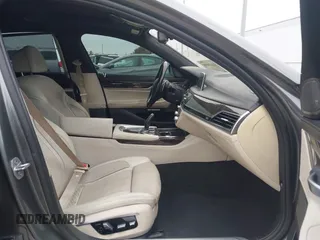 2016 BMW 7 Series 740i with VIN WBA7E2C56GG546920, listed as a IAAI auction lot 41610698 with 119,689 mi miles. Bid and sale history available at carsss.com. Image 5.
