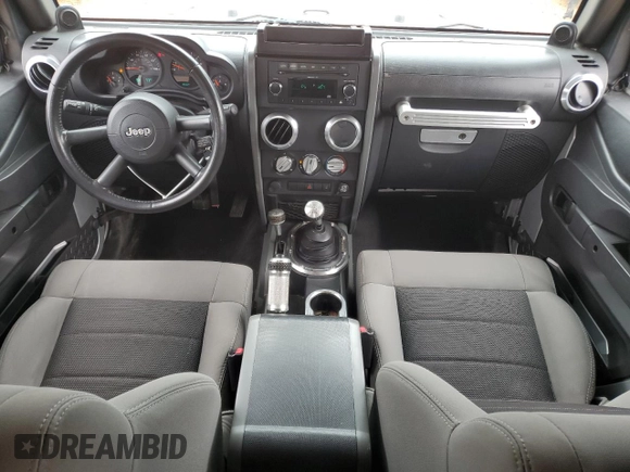 2009 Jeep Wrangler X with VIN 1J4FA24159L730840, listed as a Copart auction lot 56278745 with 95,851 mi miles and Salvage title. Bid and sale history available at DreamBid. Image 8.