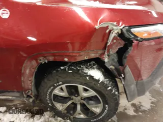 2015 Jeep Cherokee Trailhawk with VIN 1C4PJMBS2FW609999, listed as a IAAI auction lot 41582536 with 133,666 mi miles. Bid and sale history available at carsss.com. Image 6.
