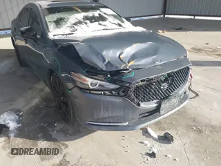 2021 Mazda 6 Carbon Edition with VIN JM1GL1WY6M1616617, listed as a IAAI auction lot 41365615 with 60,747 mi miles and . Bid and sale history available at DreamBid. Image 6.