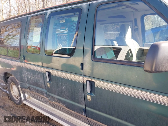1999 Ford Econoline Cargo with VIN 1FDRE14W3XHB36482, listed as a IAAI auction lot 41393346 with 130,669 mi miles. Bid and sale history available at carsss.com. Image 13.