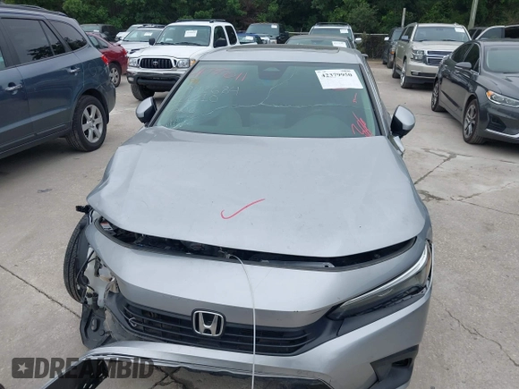 2023 Honda Civic EX with VIN 2HGFE1F77PH321210, listed as a IAAI auction lot 42379950 with Not provided miles and . Bid and sale history available at DreamBid. Image 12.