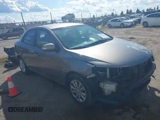 2010 Kia Forte EX with VIN KNAFU4A28A5229372, listed as a IAAI auction lot 41911118 with 166,084 mi miles. Bid and sale history available at carsss.com. Image 1.