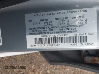 2013 Mazda 3 i SV z VIN JM1BL1TF2D1761375, wystawiony jako IAAI lot #42373558 z przebiegiem 150 196 mil mil oraz . Historia ofert i sprzedaży dostępna na DreamBid. Obrazek 9.