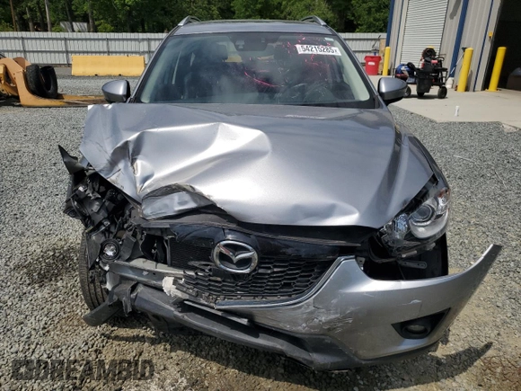 2014 Mazda CX-5 Grand Touring with VIN JM3KE4DY9E0416967, listed as a Copart auction lot 54215285 with 77,296 mi miles and Salvage Title. Bid and sale history available at DreamBid. Image 5.