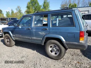 1999 Jeep Cherokee Sport with VIN 1J4FT68S1XL577603, listed as a Copart auction lot 54216115 with 180,128 mi miles and Salvage title. Bid and sale history available at DreamBid. Image 2.