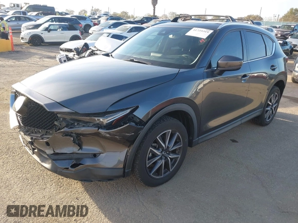 2018 Mazda CX-5 Grand Touring with VIN JM3KFBDM0J0405574, listed as a IAAI auction lot 41725319 with 44,380 mi miles. Bid and sale history available at carsss.com. Image 2.