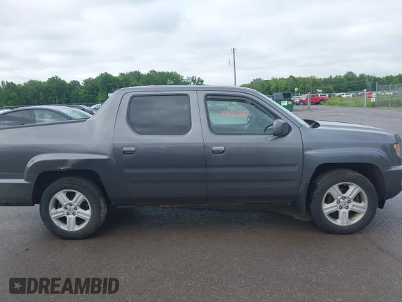 2014 Honda Ridgeline RTL with VIN 5FPYK1F5XEB011772, listed as a IAAI auction lot 42440390 with 145,219 mi miles and . Bid and sale history available at DreamBid. Image 13.