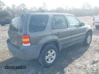 2006 Ford Escape XLT with VIN 1FMYU03Z56KC55074, listed as a IAAI auction lot 41473454 with 164,399 mi miles. Bid and sale history available at carsss.com. Image 4.