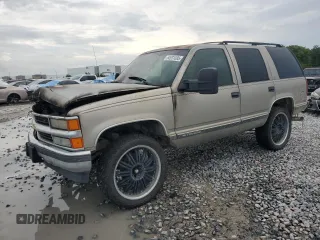 1999 Chevrolet Tahoe with VIN 1GNEC13R0XJ497169, listed as a Copart auction lot 64931085 with Not provided miles and Salvage title. Bid and sale history available at DreamBid. Image 1.