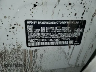 2023 BMW X1 xDrive28i with VIN WBX73EF08P5X60980, listed as a Copart auction lot 59899385 with 21,975 mi miles and Salvage title. Bid and sale history available at DreamBid. Image 14.