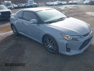 2014 Scion tC with VIN JTKJF5C71E3081033, listed as a IAAI auction lot 41928949 with 144,112 mi miles. Bid and sale history available at carsss.com. Image 1.
