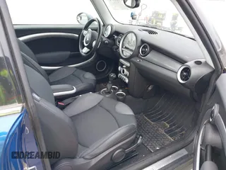 2007 MINI Hardtop S with VIN WMWMF73527TL91061, listed as a IAAI auction lot 41842104 with 65,259 mi miles and . Bid and sale history available at DreamBid. Image 5.