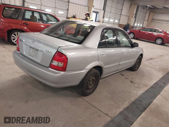2000 Mazda Protege DX with VIN JM1BJ2226Y0206340, listed as a IAAI auction lot 41645396 with 238,500 mi miles and . Bid and sale history available at DreamBid. Image 4.