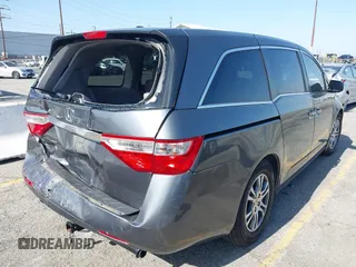 2011 Honda Odyssey EX-L with VIN 5FNRL5H64BB070836, listed as a IAAI auction lot 42520878 with 162,316 mi miles and . Bid and sale history available at DreamBid. Image 4.
