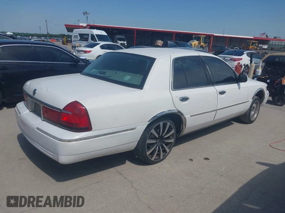 2000 Mercury Grand Marquis LS z VIN 2MEFM75W2YX731383, wystawiony jako IAAI lot #42262528 z przebiegiem 172 940 mil mil oraz . Historia ofert i sprzedaży dostępna na DreamBid. Obrazek 4.