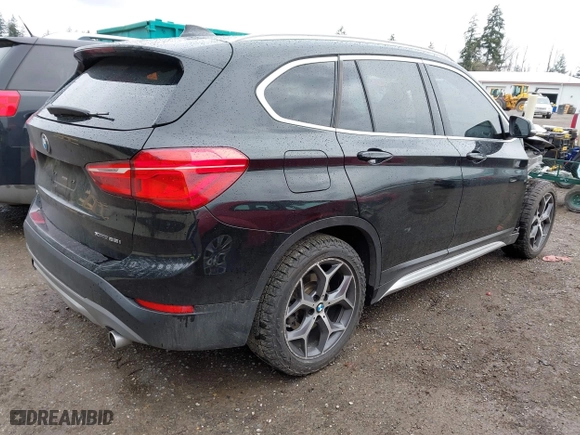 2018 BMW X1 xDrive28i with VIN WBXHT3C39J3H30531, listed as a IAAI auction lot 41890734 with 59,147 mi miles. Bid and sale history available at carsss.com. Image 4.