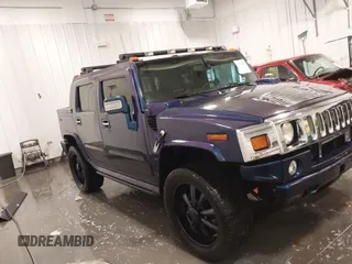 2006 Hummer H2 z VIN 5GRGN22U06H103603, wystawiony jako IAAI lot #41992767 z przebiegiem 165 782 mil mil oraz . Historia ofert i sprzedaży dostępna na DreamBid. Obrazek 14.