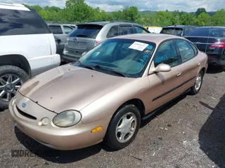 1997 Ford Taurus GL z VIN 1FALP52U9VA280563, wystawiony jako IAAI lot #42045413 z przebiegiem 219 484 mil mil oraz . Historia ofert i sprzedaży dostępna na DreamBid. Obrazek 2.