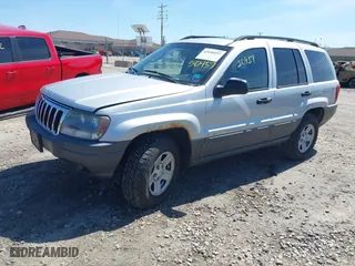 2002 Jeep Grand Cherokee Laredo with VIN 1J4GW48S42C324297, listed as a IAAI auction lot 42050957 with 135,542 mi miles. Bid and sale history available at carsss.com. Image 2.