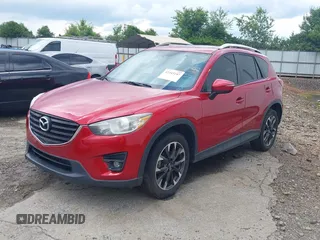 2016 Mazda CX-5 Grand Touring z VIN JM3KE2DY6G0693678, wystawiony jako IAAI lot #42443247 z przebiegiem 127 620 mil mil oraz . Historia ofert i sprzedaży dostępna na DreamBid. Obrazek 17.
