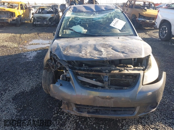 2010 Suzuki SX4 with VIN JS2YC5A40A6300053, listed as a IAAI auction lot 41392061 with 114,863 mi miles and . Bid and sale history available at DreamBid. Image 6.