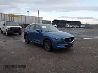 2019 Mazda CX-5 Sport with VIN JM3KFBBM5K0668678, listed as a IAAI auction lot 41811146 with 102,634 mi miles and . Bid and sale history available at DreamBid. Image 1.