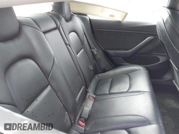 2021 Tesla Model 3 Standard Range Plus z VIN 5YJ3E1EA5MF941392, wystawiony jako IAAI lot #41888597 z przebiegiem 111 617 mil mil oraz . Historia ofert i sprzedaży dostępna na DreamBid. Obrazek 8.