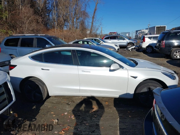 2018 Tesla Model 3 Long Range Battery with VIN 5YJ3E1EB5JF108633, listed as a IAAI auction lot 41016970 with 90,175 mi miles and . Bid and sale history available at DreamBid. Image 13.